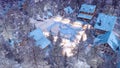 Snowbound alpine township at winter night top view