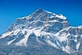 Snowbound mountain peak.