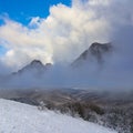 snowbound mountain ridge in mist