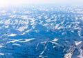 Snowbound mountains Alps. Top view from airplane.