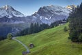 Snowcapped Bernese Swiss alps and alpine farms, Switzerland Royalty Free Stock Photo