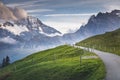 Snowcapped Bernese Swiss alps and mountain road in Murren, Switzerland Royalty Free Stock Photo