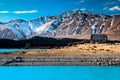 Snowcapped mountain and crystal blue water in front of the Church of the Good Shepard New Zealand Royalty Free Stock Photo