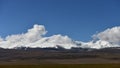 Snowcapped mountains and clouds at Ukok Plateau