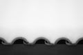 Snowcapped wavy rooftop tiles in black and white Royalty Free Stock Photo