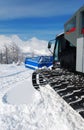 Snowcat in mountains