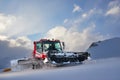 Snowcat rides to work in the evening Royalty Free Stock Photo