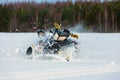 In snowdrift rider loss control and fall off from snowmobile
