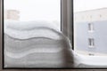 snowdrift between window glasses at home Royalty Free Stock Photo