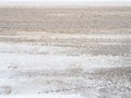 Snowdrifts on the side of the road. Bad weather and traffic. Snow on asphalt. Difficult driving conditions. Winter slosh Royalty Free Stock Photo