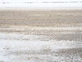 Snowdrifts on the side of the road. Bad weather and traffic. Snow on asphalt. Difficult driving conditions. Winter slosh Royalty Free Stock Photo