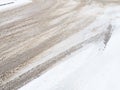 Snowdrifts on the side of the road. Bad weather and traffic. Snow on asphalt. Difficult driving conditions. Winter slosh Royalty Free Stock Photo