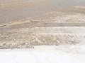 Snowdrifts on the side of the road. Bad weather and traffic. Snow on asphalt. Difficult driving conditions. Winter slosh Royalty Free Stock Photo