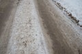 Snowdrifts on the side of the road. Bad weather and traffic. Snow on asphalt. Difficult driving conditions. Winter slush Royalty Free Stock Photo