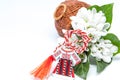 Snowdrops and red and white string martisor on white with copy space east european first of march tradition celebration