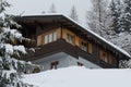 Snowed-family house in the forest