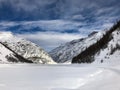 Snowed Livigno lake in winter Royalty Free Stock Photo