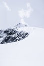 Snowed mountain summit and rocks in Himalaya