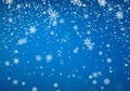 Snowfall Christmas background. Flying snow flakes and stars on winter blue sky background. Winter wite snowflake template. Vector Royalty Free Stock Photo