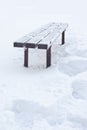 After snowfall and rain bench all has iced over Royalty Free Stock Photo