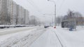 After the snowfall, there is snow on the streets of the city. The sidewalks and roadways have been cleared by utilities, but they Royalty Free Stock Photo