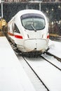 snowfall at the train station in Wiesbaden, Germany with highspeed train in snow Royalty Free Stock Photo