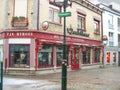 Snowfall in winter city. Shop on the street in Valkenburg. Netherlands Royalty Free Stock Photo