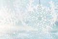 Snowflake on a blue festive background. Beautiful Christmas background