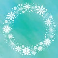 White snowflakes illustrated in a circular motion isolated on an aqua blue blured backdrop