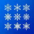 Snowflake icon set. white color snowflakes isolated on blue background. Winter christmas snowflake crystal decoration element. Royalty Free Stock Photo