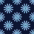 Seamless pattern made of snowflakes on a dark blue background
