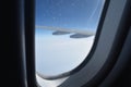 Snowflake on plane window frame height in sky