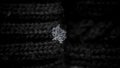 Snowflake on the wool knit background. snowflakes. natural snowflakes on knitted, mittens photo real snowflakes during a snowfall