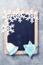 Snowflakes border on chalkboard. Christmas background with copy space. New Year and Christmas. Chalkboard mock up with snowflakes