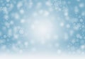 Snowflakes and fallen defocused snowflakes on blue christmas background Royalty Free Stock Photo