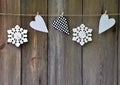 Snowflakes and hearts on old wooden background. Country style. C Royalty Free Stock Photo