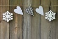 Snowflakes and hearts on old wooden background. Country style. C Royalty Free Stock Photo