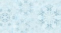 Snowflakes with intricate patterns on a light blue background. Th Royalty Free Stock Photo