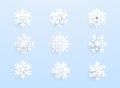 Snowflakes with shadow on blue background. Vector set of white Christmas paper cut 3d snowflakes Royalty Free Stock Photo