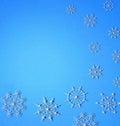 Delicate winter openwork pattern in the form of white snowflakes on a blue background