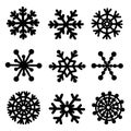 Snowflakes vector icon set. Hand-drawn black silhouettes of ice crystals isolated on white background. Royalty Free Stock Photo