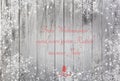 Snowflakes on a wood background with the text Merry Christmas and a Happy New Year