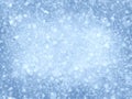 Snowing abstract blurred texture on a cold blue winter background. Snow light pattern Royalty Free Stock Photo