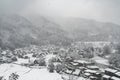 Snowing at country small village in the valley, winter season Royalty Free Stock Photo