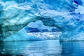 Snowing Floating Blue Iceberg Arch Reflection Paradise Bay Skintorp Cove Antarctica Royalty Free Stock Photo