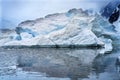 Snowing Floating Blue Iceberg Arch Reflection Paradise Bay Skintorp Cove Antarctica Royalty Free Stock Photo