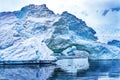 Snowing Floating Blue Iceberg Arch Reflection Paradise Bay Skintorp Cove Antarctica Royalty Free Stock Photo