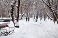 Snowing landscape in the park with people passing by Royalty Free Stock Photo