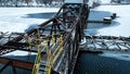 Snowing over the old rusty swing bridge in the morning Royalty Free Stock Photo