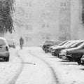 Snowing urban landscape with people Royalty Free Stock Photo